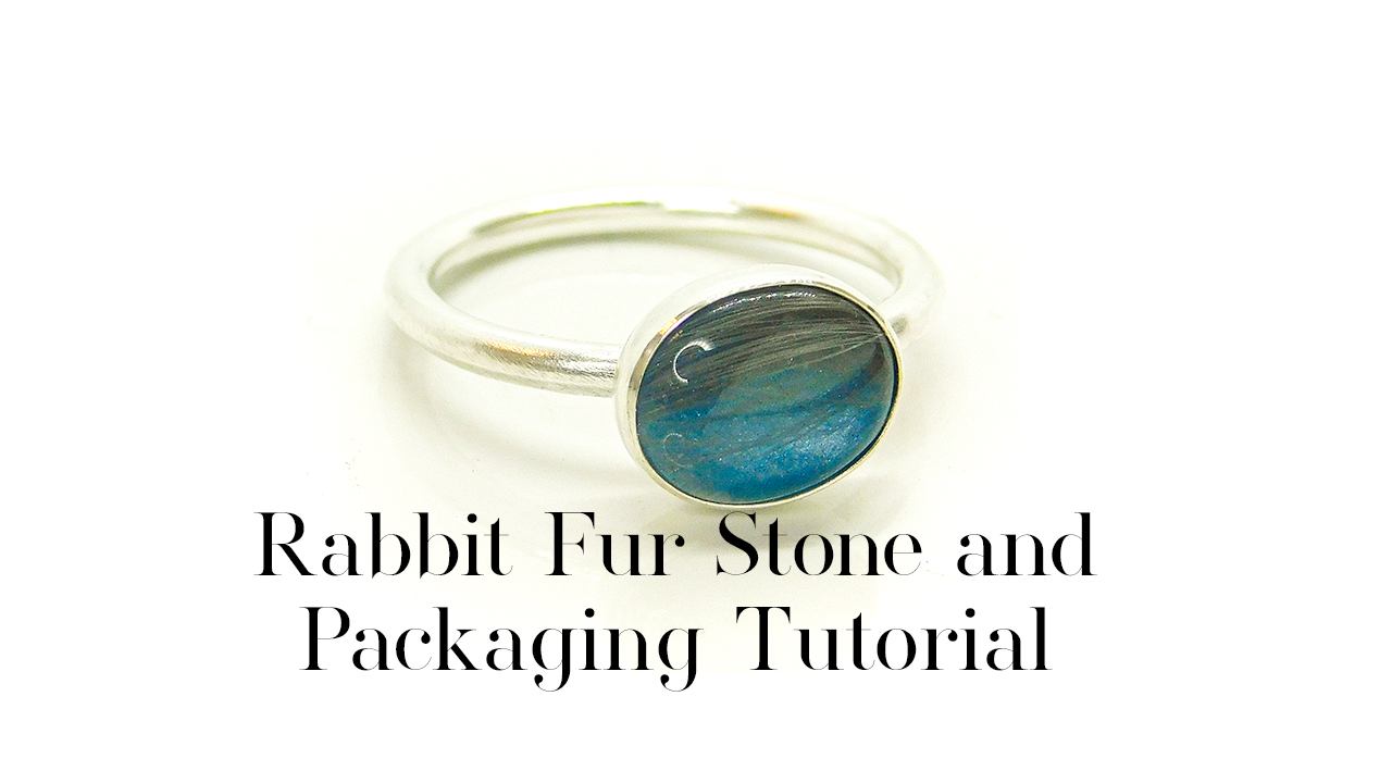 Rabbit Fur Stone and Packaging Tutorial blue rabbit fur ring front, handmade solid Argentium silver ring setting, 10x8mm oval setting with Aegean blue resin sparkle mix and grey rabbit fur