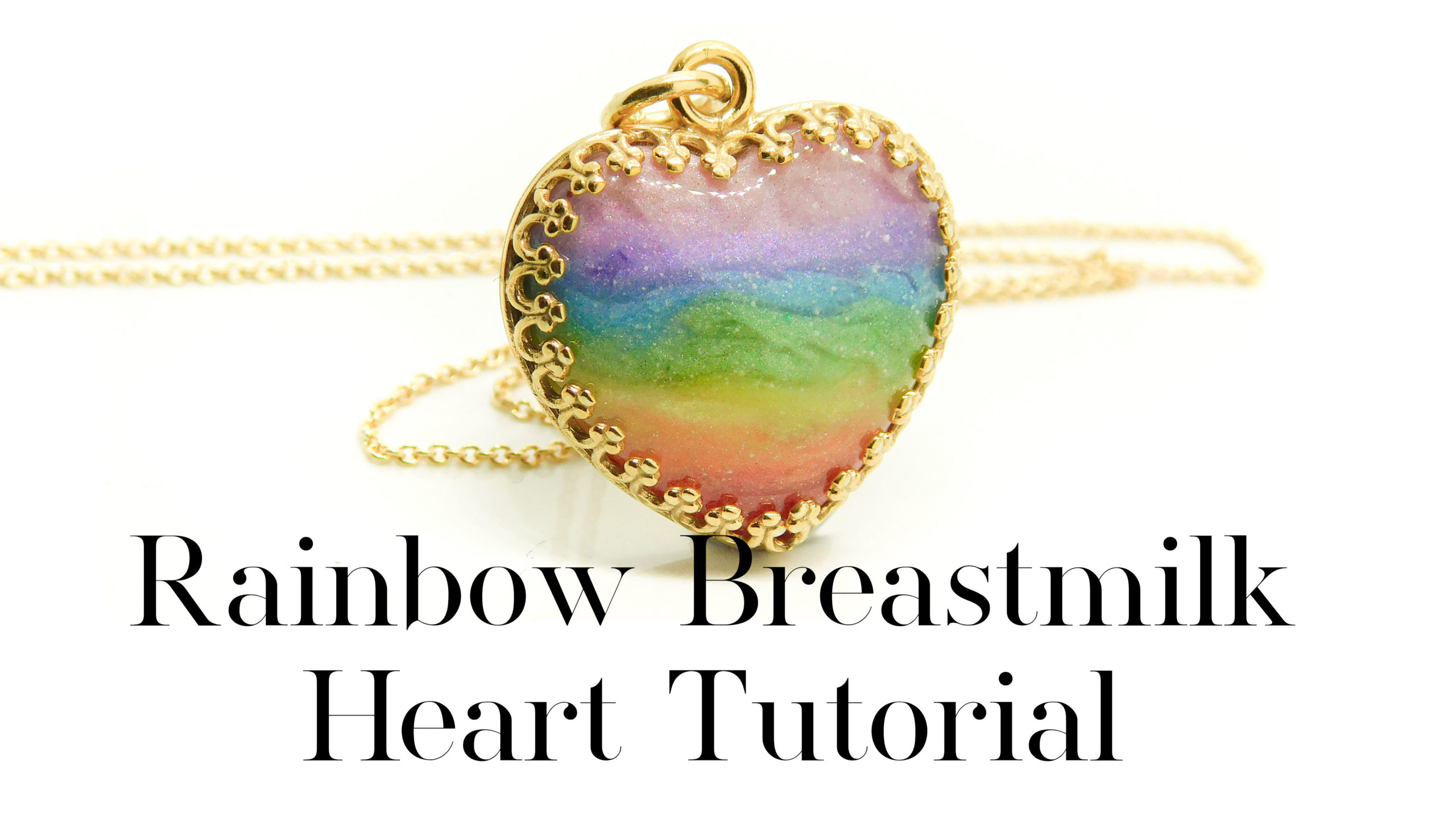 Rainbow Breastmilk Heart Tutorial, breastmilk rainbow gold necklace, gold plated solid silver setting and chain. 18mm crown point gold vermeil heart, breastmilk and shimmery pastel rainbow colours. Handmade breastfeeding keepsake jewellery tutorial on YouTube
