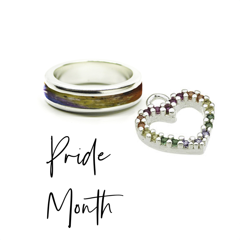Pride Month Jewellery - chunky full channel ring with cremation ashes and rainbow and a rainbow dangle charm for permanent jewellery, rainbow